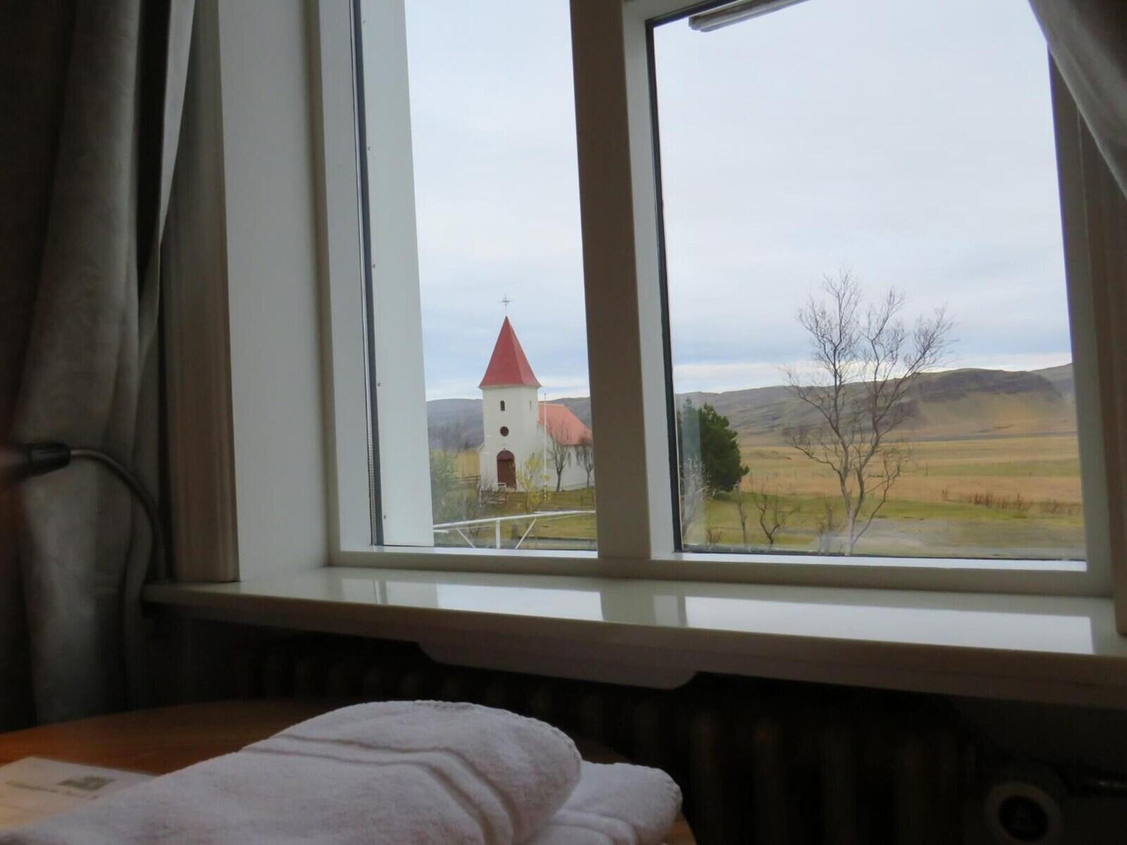 View from a guest room window towards Kálfafellsstaðarkirkja