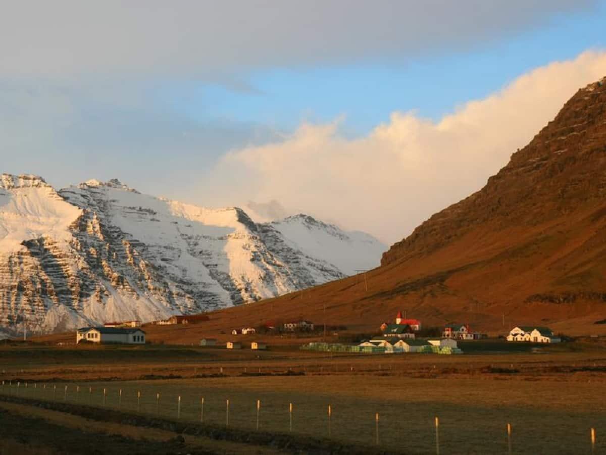 Mountains and the farm in Suðursveit